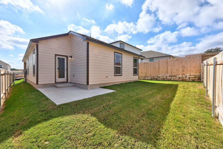 Exterior details and patio area of a home in Creekside at Estancia, Austin (Image 4).