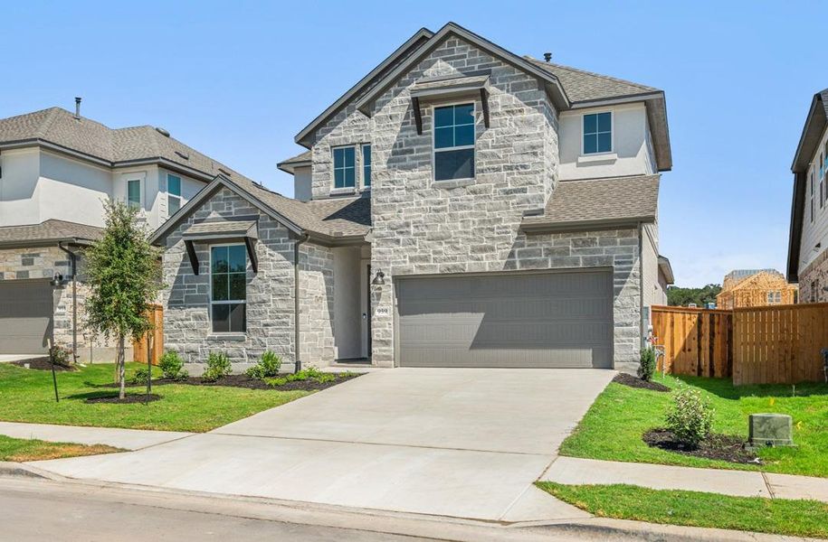 Front exterior of a new home in Arbor Collection at Heritage, Dripping Springs, TX, highlighting curb appeal (Image 2).