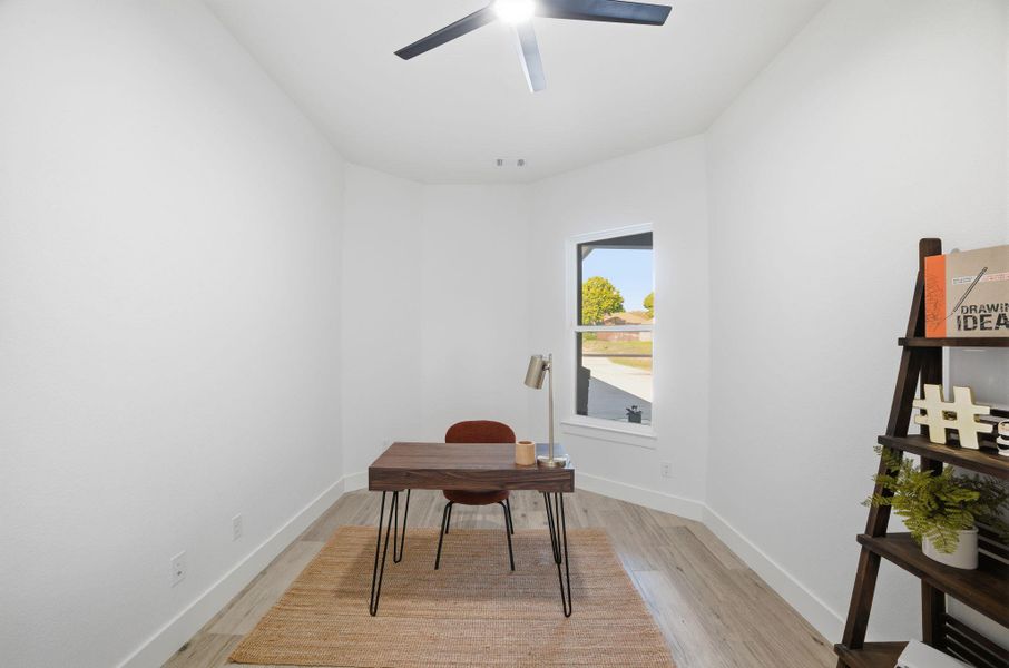 Home office featuring light wood-type flooring Home office featuring light wood-type flooring