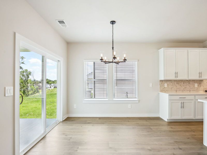 Dining room in the Sherwood floorplan in a Meritage Homes community. Dining room in the Sherwood floorplan in a Meritage Homes community.