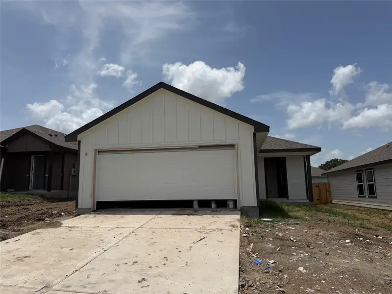 Front exterior of a new home in Wilkins Valley, Brenham, TX, highlighting curb appeal (Image 1). Front exterior of a new home in Wilkins Valley, Brenham, TX, highlighting curb appeal (Image 1).