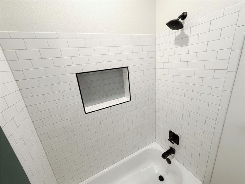 Bathroom with shower / bathtub combination Bathroom with shower / bathtub combination