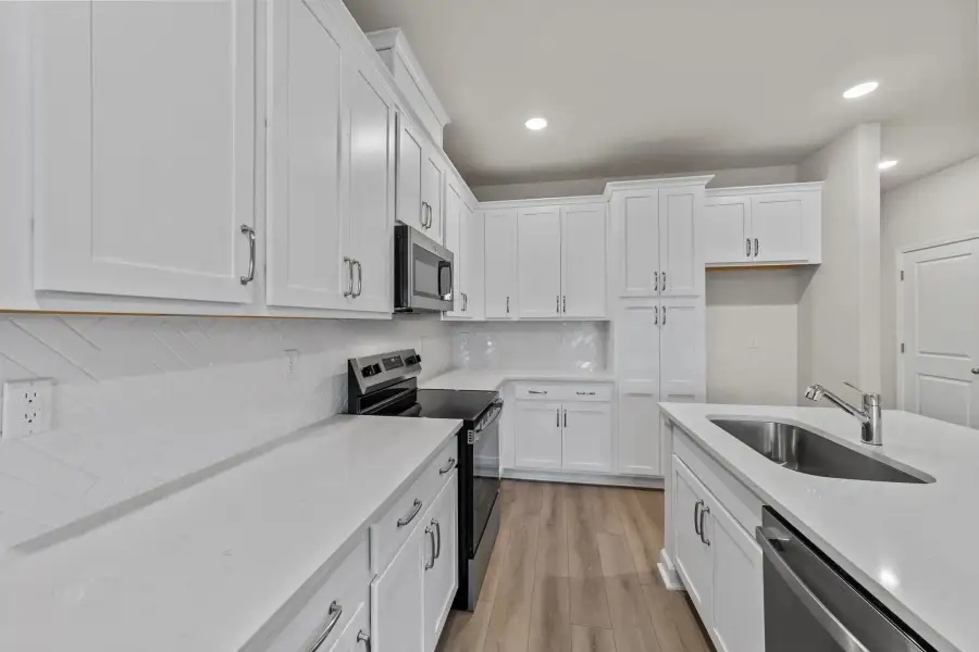 Sample Kitchen photo. Actual structural options and design finishes of home may vary.