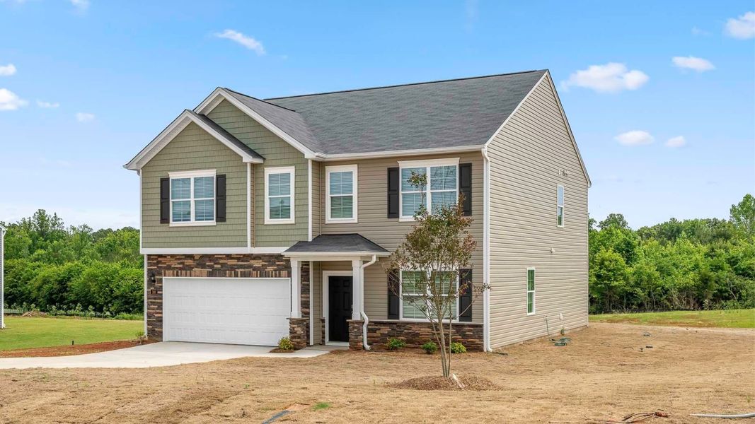 Front exterior of a new home in Brookhaven, Greensboro, NC, highlighting curb appeal (Image 2). Front exterior of a new home in Brookhaven, Greensboro, NC, highlighting curb appeal (Image 2).