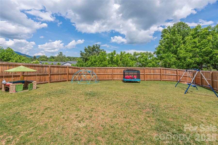 Large fenced in and double gated back yard, easy access to playground and nature trail.