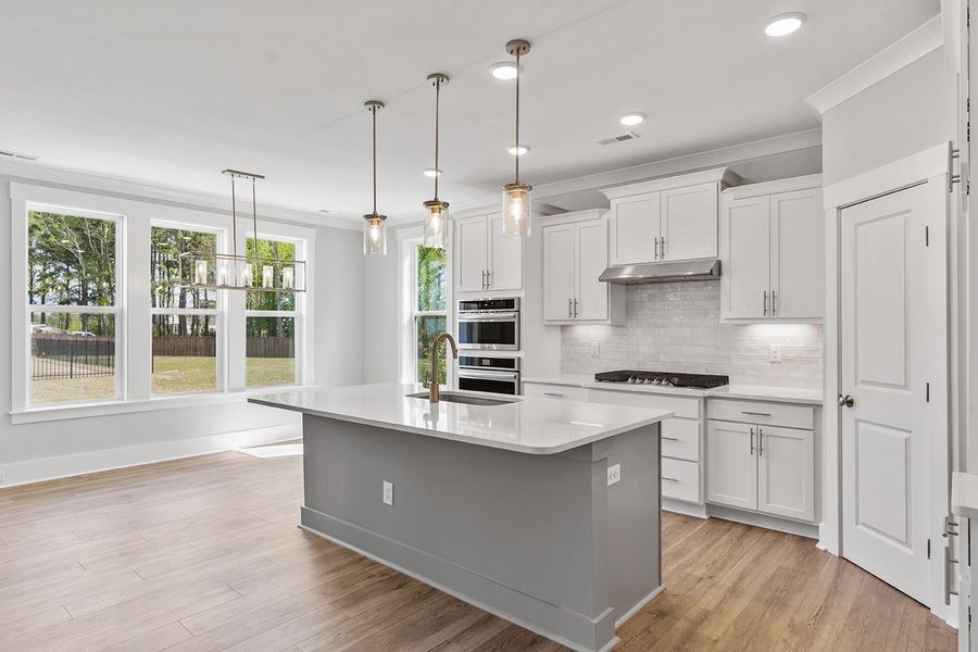 Representative furnished interior of a home built from the The Chandler by RobuckHomes in Windwater, Hampstead (Image 11).