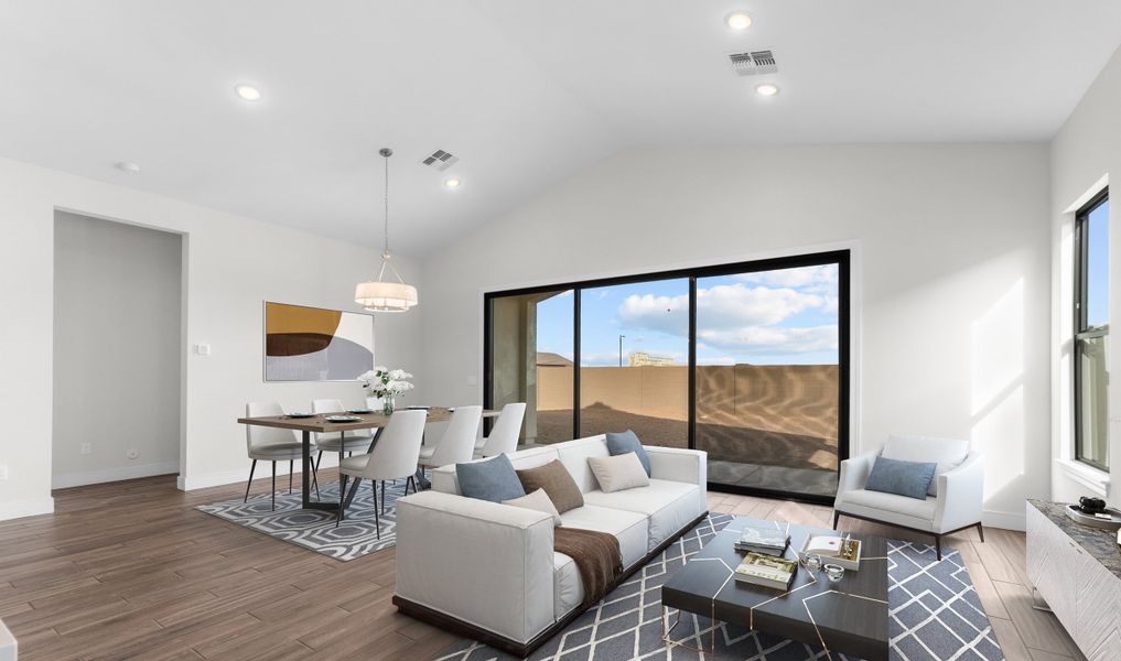 Great room and dining area with vaulted ceiling