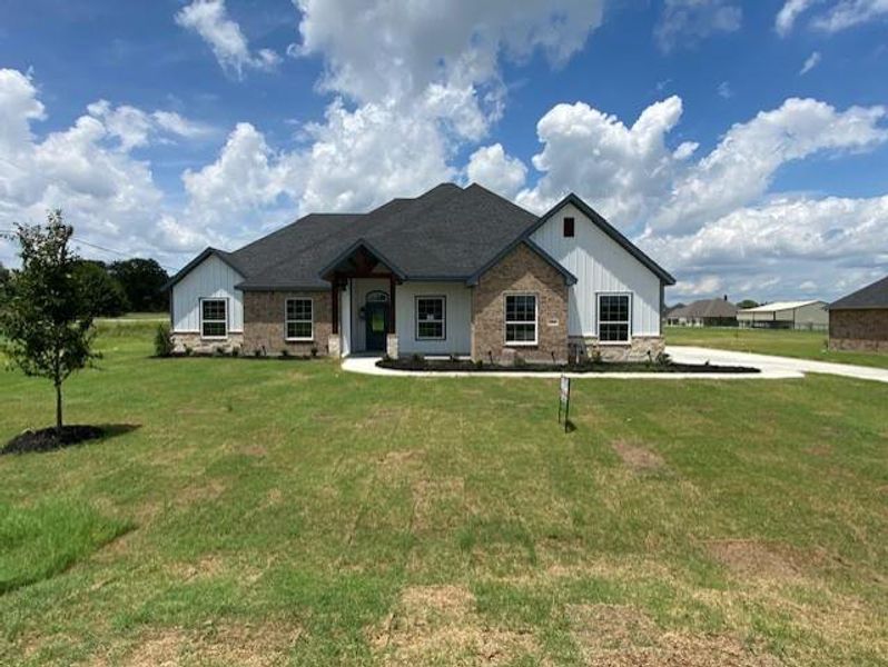 Front exterior of a new home in , Reno, TX, highlighting curb appeal (Image 1).
