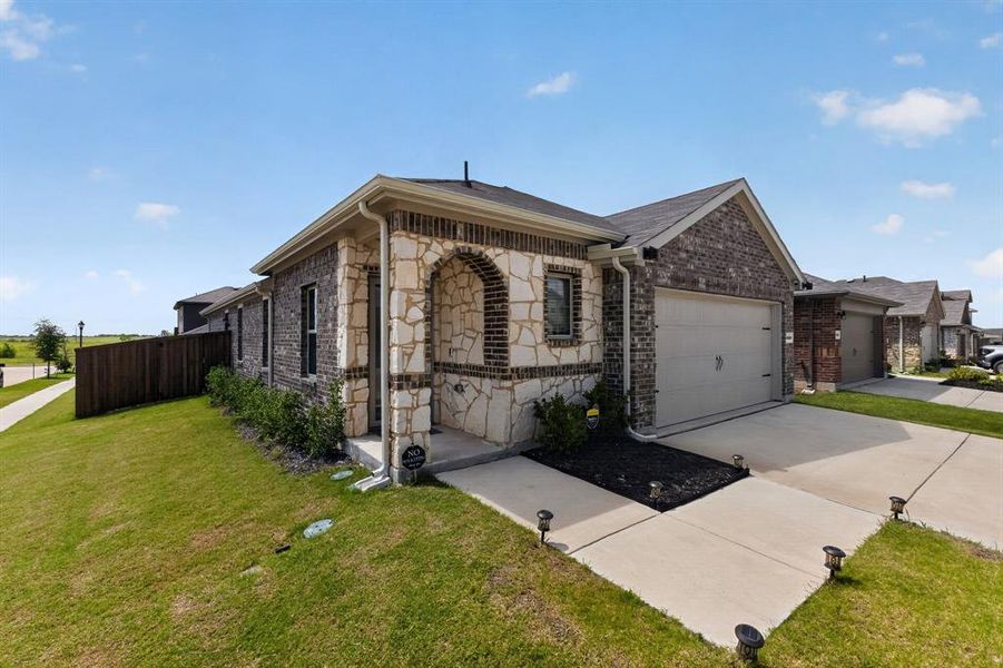 Front exterior of a new home in , Crandall, TX, highlighting curb appeal (Image 22). Front exterior of a new home in , Crandall, TX, highlighting curb appeal (Image 22).