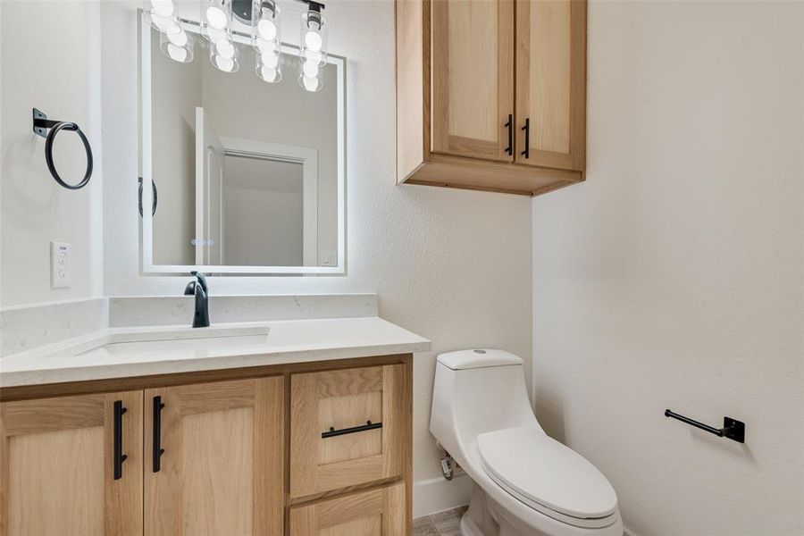 Bathroom with vanity and toilet