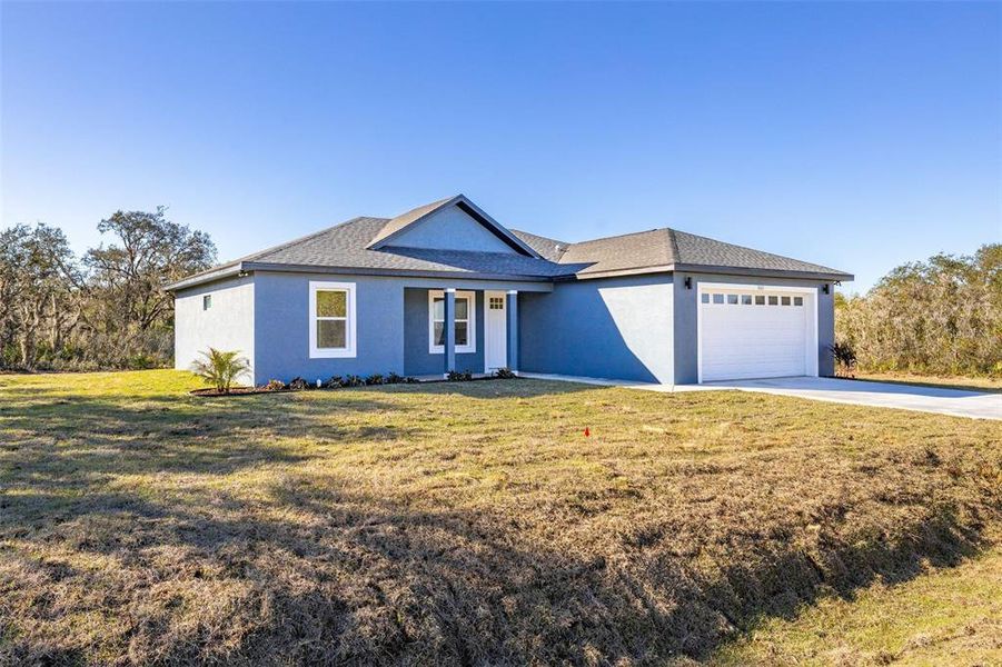 Front exterior of a new home in , Avon Park, FL, highlighting curb appeal (Image 21). Front exterior of a new home in , Avon Park, FL, highlighting curb appeal (Image 21).