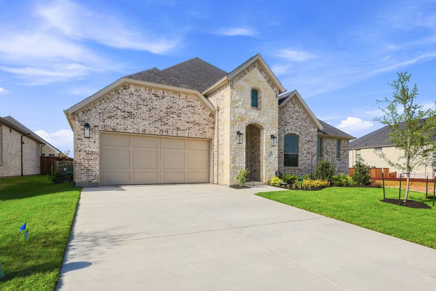 Front exterior of a new home in The Homestead - 62', Rockwall, TX, highlighting curb appeal (Image 22).