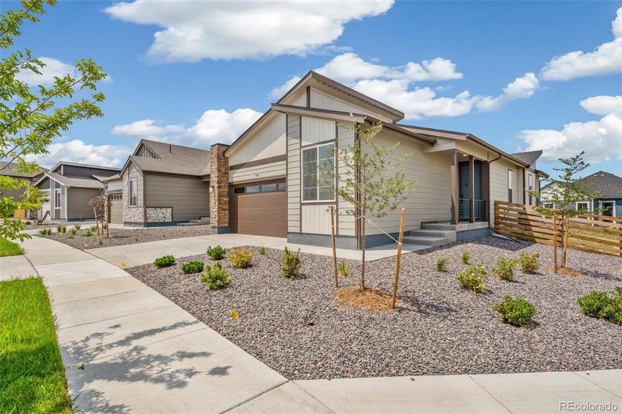 Front exterior of a new home in Legato, Commerce City, CO, highlighting curb appeal (Image 22).