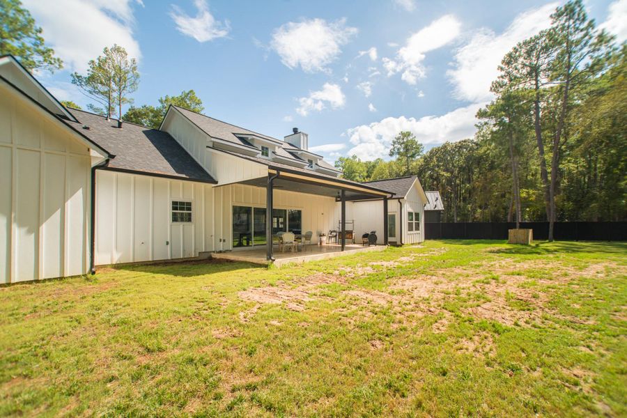 Enjoy the outdoors in style on the covered rear patio, featuring a summer kitchen Enjoy the outdoors in style on the covered rear patio, featuring a summer kitchen
