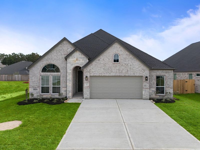 Front exterior of a new home in Barton Creek Ranch, Conroe, TX, highlighting curb appeal (Image 14).