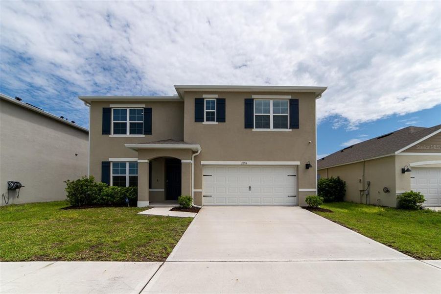 Front exterior of a new home in , Harmony, FL, highlighting curb appeal (Image 28).
