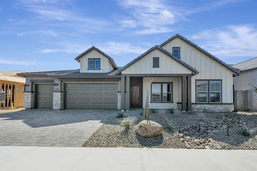 Front exterior of a new home in Sentiero at Windrose, Waddell, AZ, highlighting curb appeal (Image 1). Front exterior of a new home in Sentiero at Windrose, Waddell, AZ, highlighting curb appeal (Image 1).