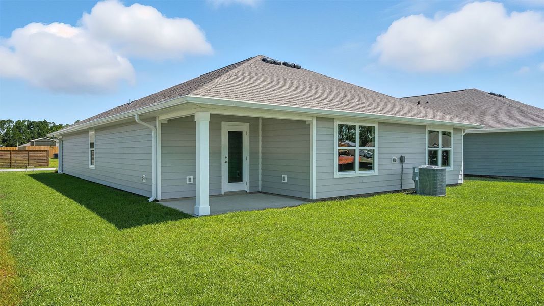 Front exterior of a new home in Palmetto Bluff, Port Saint Joe, FL, highlighting curb appeal (Image 18).
