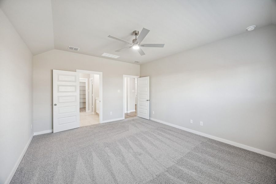 Primary Suite in the Heisman home plan by Trophy Signature Homes – REPRESENTATIVE PHOTO