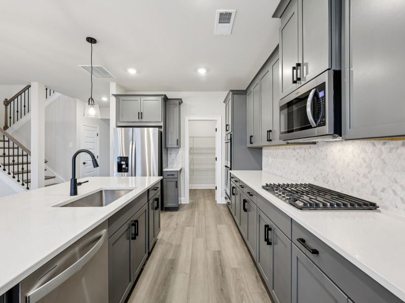 Furnished interior view inside a new home in Vines at Mill Creek - Estate Series, Braselton (Image 7).