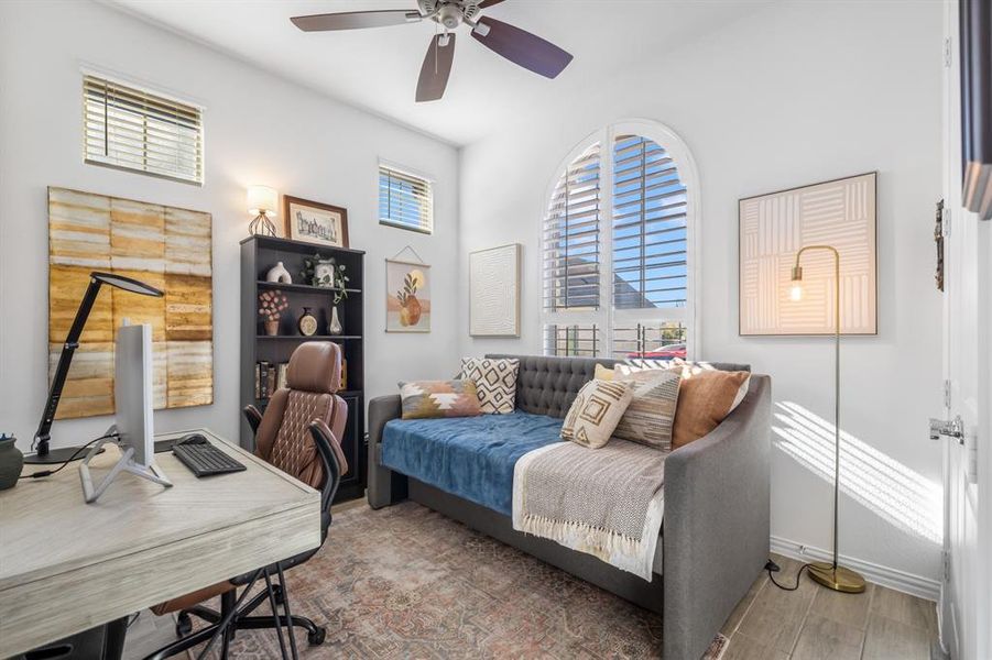 Office space featuring wood finished floors and ceiling fan Office space featuring wood finished floors and ceiling fan