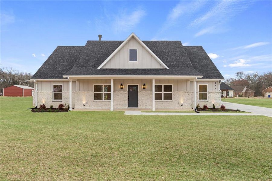 View of front of property with a front lawn