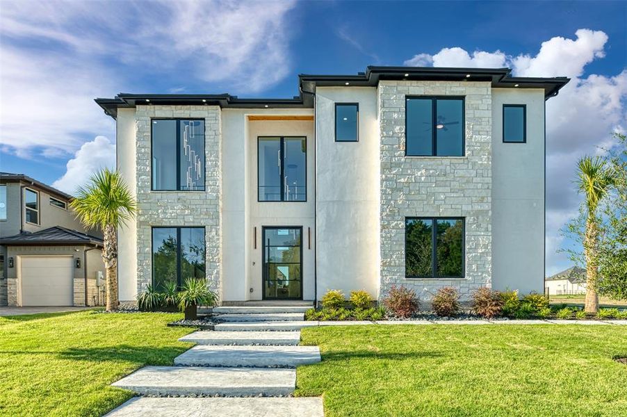 Front exterior of a new home in , Heath, TX, highlighting curb appeal (Image 23). Front exterior of a new home in , Heath, TX, highlighting curb appeal (Image 23).