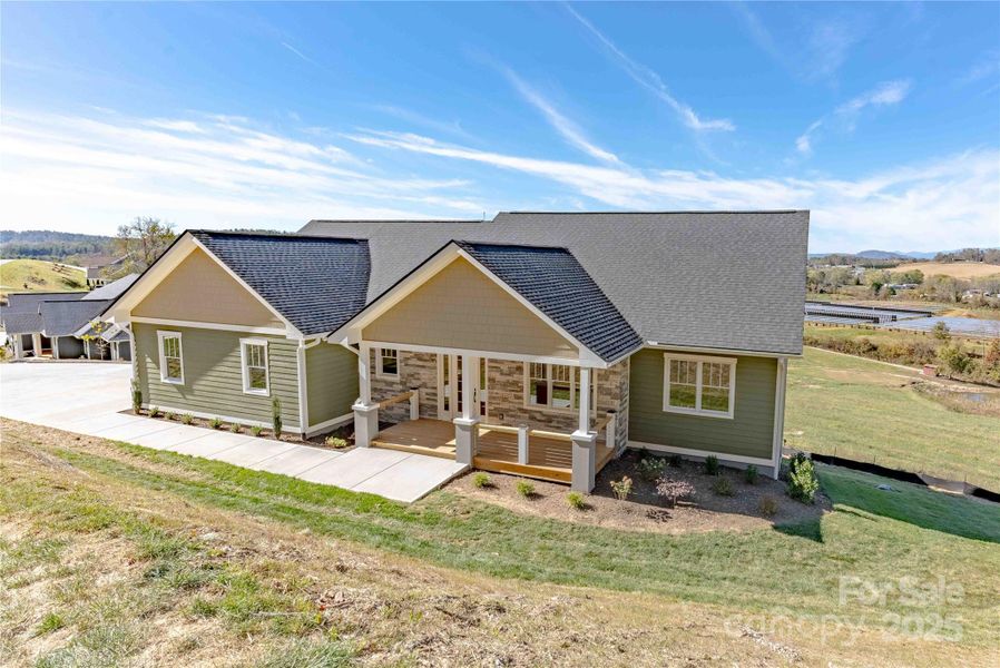 Front exterior of a new home in , Hendersonville, NC, highlighting curb appeal (Image 17).