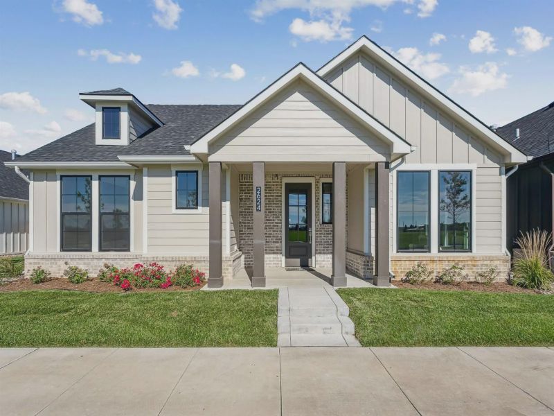 Front exterior of a new home in The Courtyards at The Moorings, Wichita, KS, highlighting curb appeal (Image 1). Front exterior of a new home in The Courtyards at The Moorings, Wichita, KS, highlighting curb appeal (Image 1).