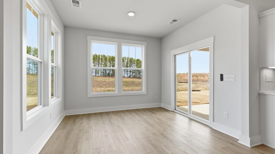 Notable breakfast area with high standards and elegant millwork in this accomplished home at the Foxbank community