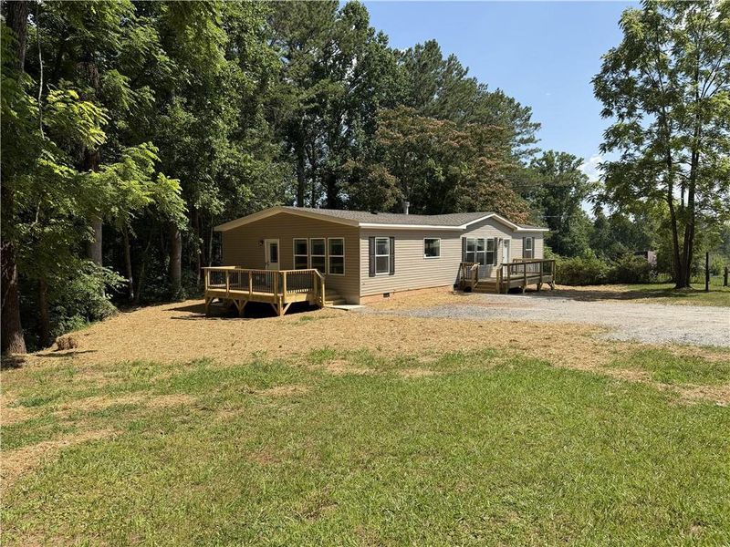 Exterior details and patio area of a home in , Ball Ground (Image 24).