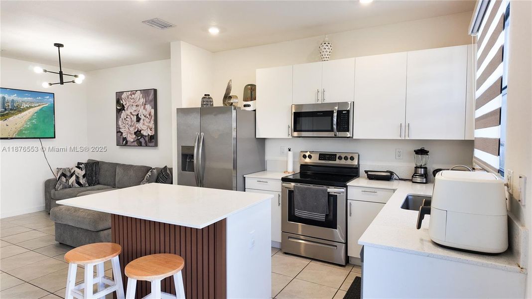 Furnished interior view inside a new home in , Homestead (Image 4). Furnished interior view inside a new home in , Homestead (Image 4).