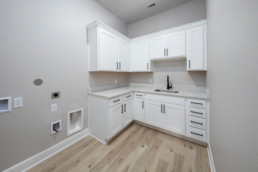 Furnished interior view inside a new home in Sierra Vista, Iowa Colony (Image 6).