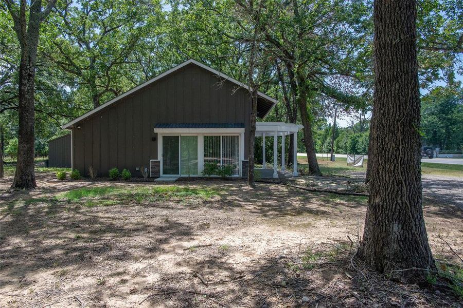 Exterior details and patio area of a home in , Log Cabin (Image 3).
