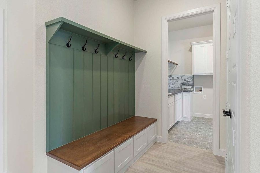 Mudroom with light wood finished floors