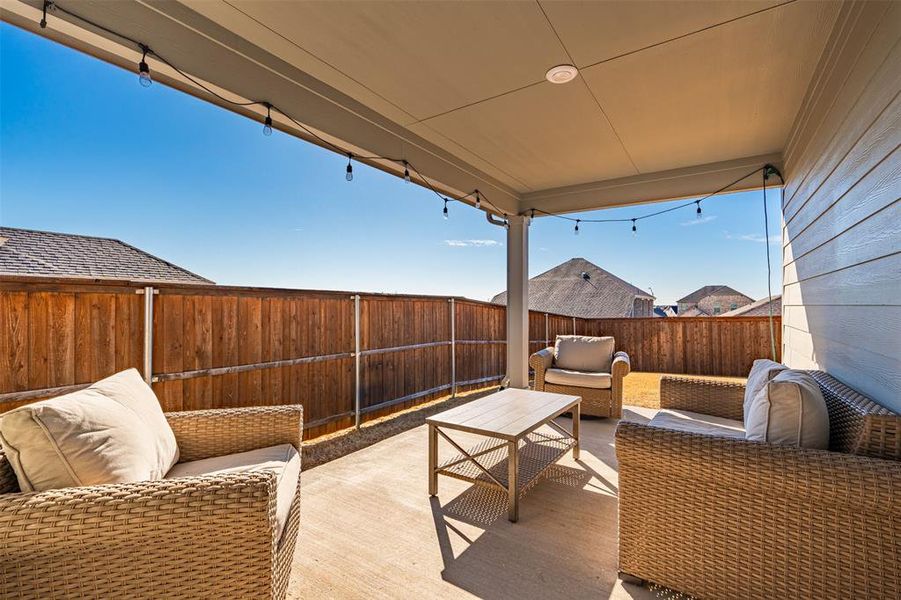 View of patio featuring a fenced backyard and an outdoor living space