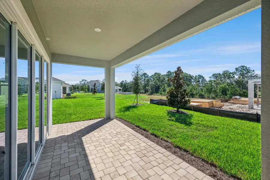 Exterior details and patio area of a home in Northlake at Ovation, Winter Garden (Image 21).