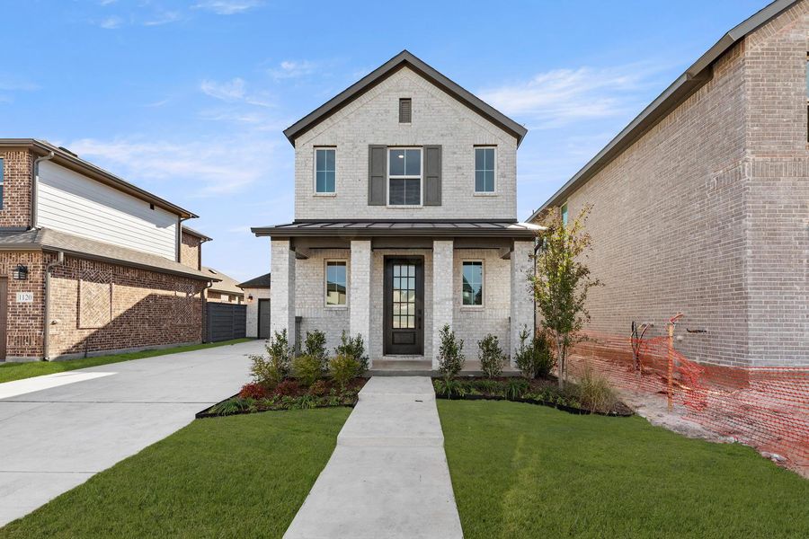 Front exterior of a new home in Garden Collection at Union Park, Little Elm, TX, highlighting curb appeal (Image 1). Front exterior of a new home in Garden Collection at Union Park, Little Elm, TX, highlighting curb appeal (Image 1).