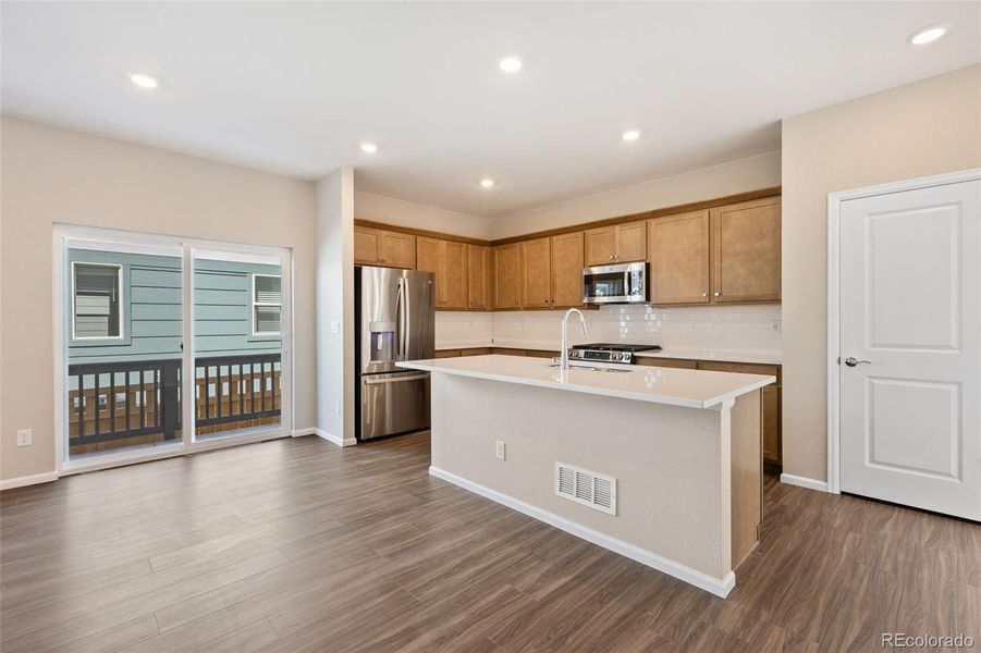 Furnished interior view inside a new home in Woodrose at Painted Prairie, Aurora (Image 12).