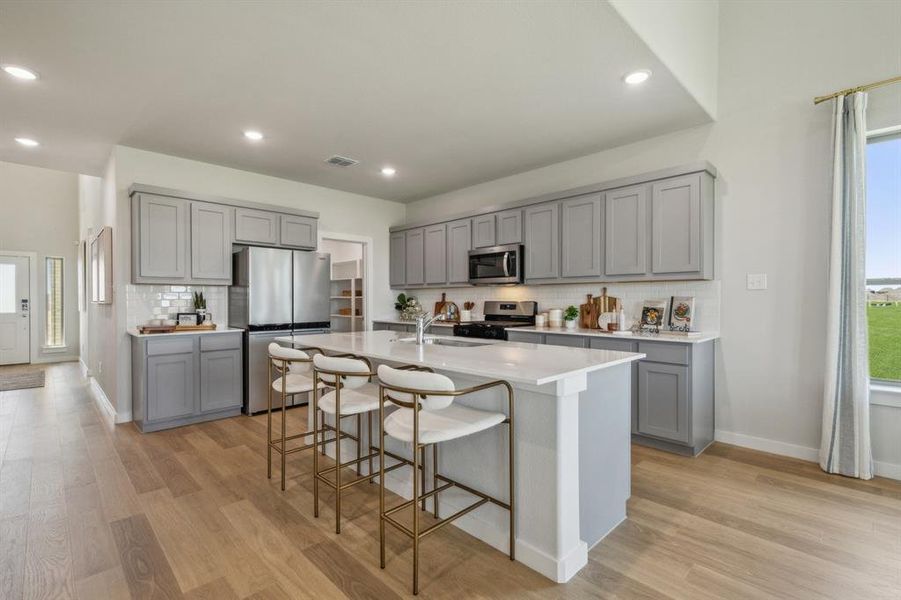Kitchen in the Winters home plan by Trophy Signature Homes  REPRESENTATIVE PHOTO