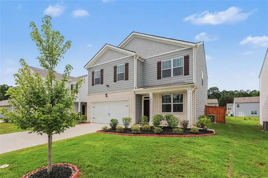 Front exterior of a new home in , Fairburn, GA, highlighting curb appeal (Image 27). Front exterior of a new home in , Fairburn, GA, highlighting curb appeal (Image 27).