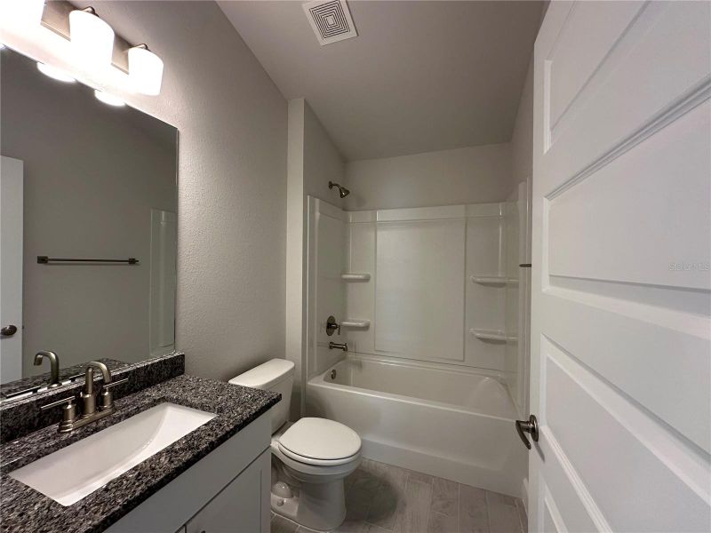 Furnished interior view inside a new home in Densan Park, Wildwood (Image 10).