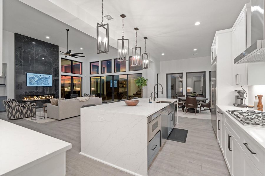 The main level is thoughtfully curated for both grand entertaining and everyday living, featuring a private study, an expansive great room, formal dining area, and a chef-inspired kitchen outfitted with premium luxury appliances, a walk-in pantry, and an oversized center island ideal for gathering.