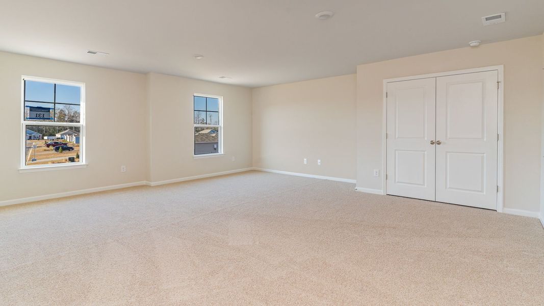 Representative unfurnished interior of a home built from the WREN by D.R. Horton in Saltgrass Landing, Winnabow (Image 24).