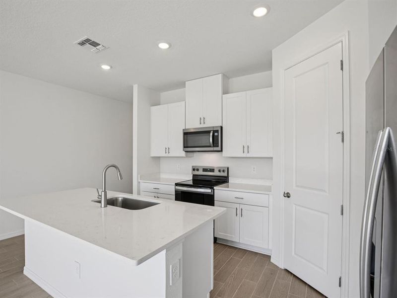 Furnished interior view inside a new home in Coasterra - Reserve Series, Palmetto (Image 11).