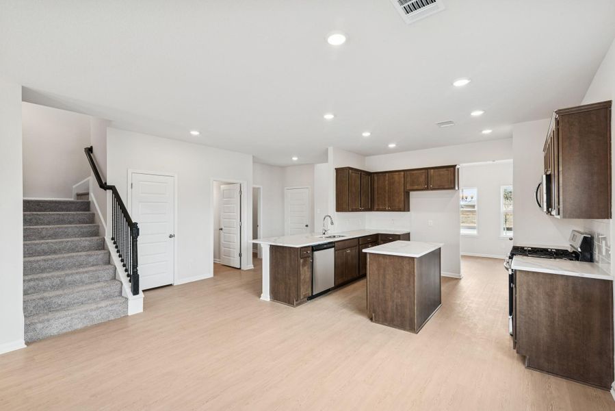 The Georgetown II- Breakfast Area into Kitchen. Home under construction, photo used for illustrative purposes only, colors and options will vary.