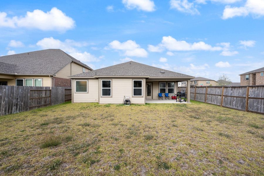 Exterior details and patio area of a home in Sierra Vista, Iowa Colony (Image 26).