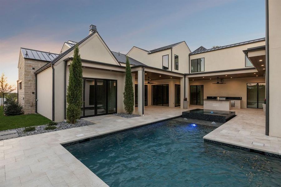 Back of property featuring a standing seam roof and a metal roof Back of property featuring a standing seam roof and a metal roof
