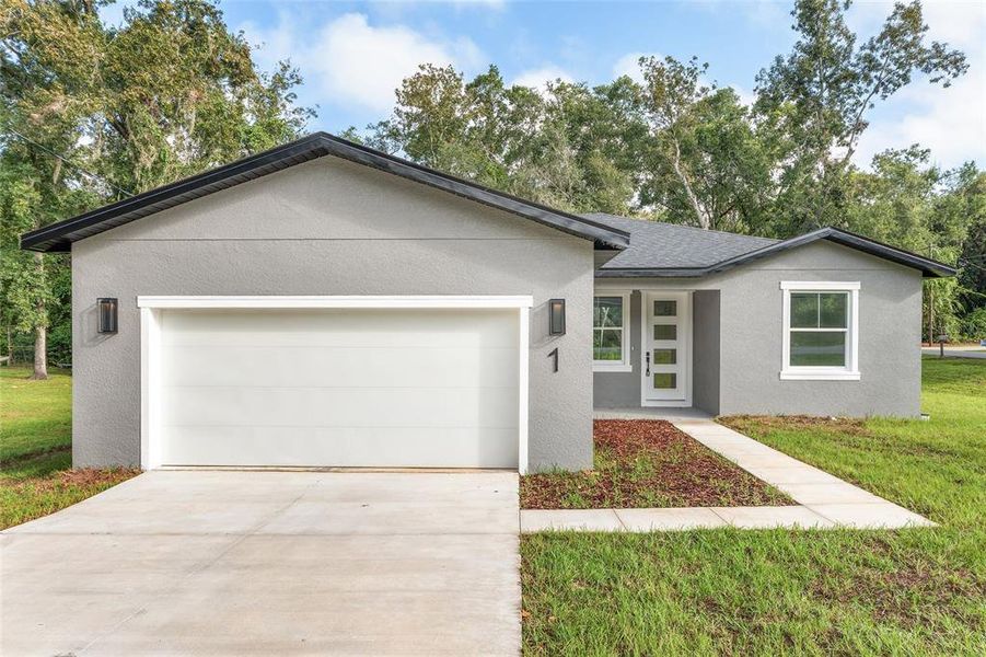 Front exterior of a new home in , Ocala, FL, highlighting curb appeal (Image 2).