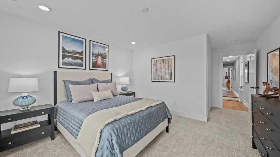 Vibrant and inviting secondary bedroom featuring a walk-in closet and refined finishes Vibrant and inviting secondary bedroom featuring a walk-in closet and refined finishes